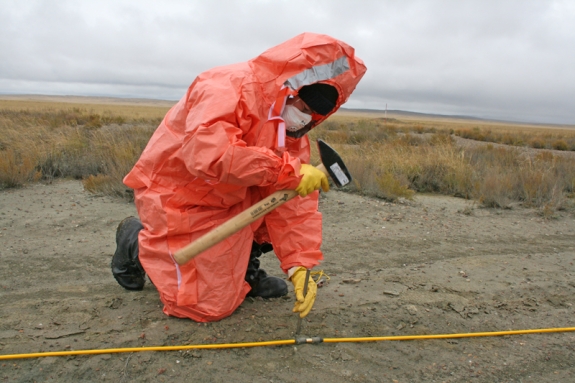 An inspector positions electrodes for shallow electrical conductivity measurements.