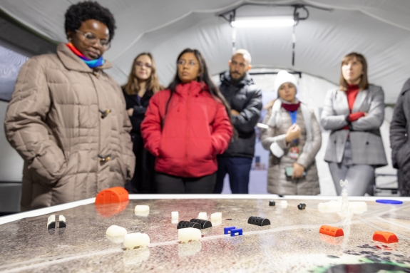 Participants looking at Integrated Field Exercise (IFE) diorama, On-Site Inspection Division (OSI) 