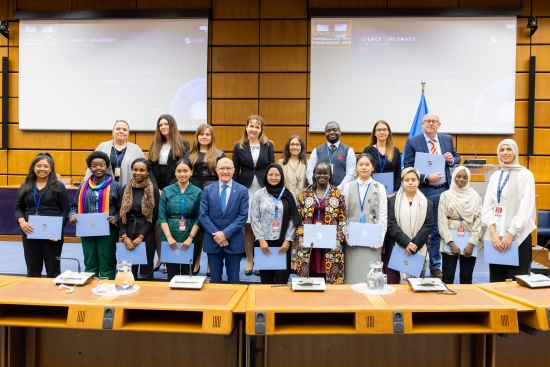 2022 CTBTO Mentoring Programme participants in a conference room with CTBTO Executive Secretary Dr Robert Floyd. 
