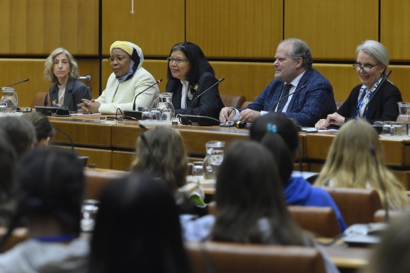 Representatives of international organizations addressing audience during opening session