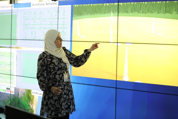 Software Engineer Ichrak Ketata explaining how CTBTO's monitoring system picks up signs of nuclear testing