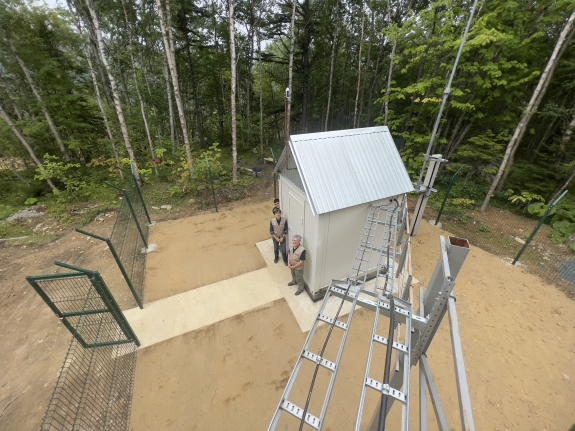 AS92 site: security fence, cable tray and borehole enclosure - a deep hole or well that is drilled into the ground to house seismic sensors or seismometers
