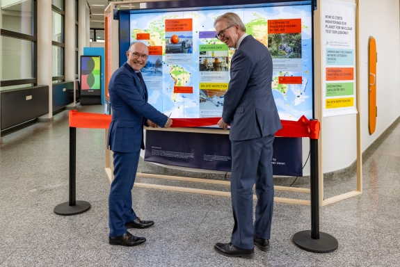 Floyd and Ambassador Hallergård cutting ribbon at opening event 
