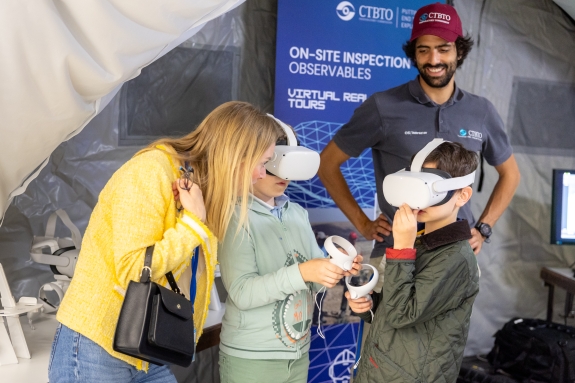 Children using virtual reality goggles to take part in On-Site Inspection (OSI) tours