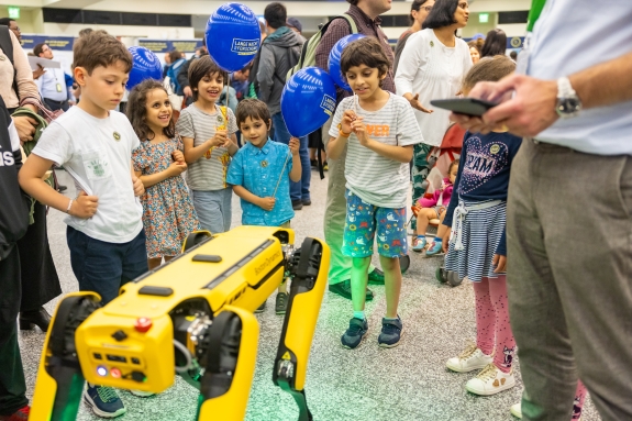 Children interacting with CTBTO’s robot dog 