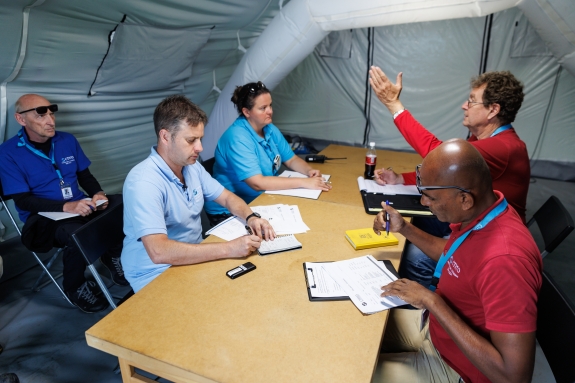 Representatives of the Inspection team and the Inspected State Party meet to negotiate OSI aspects