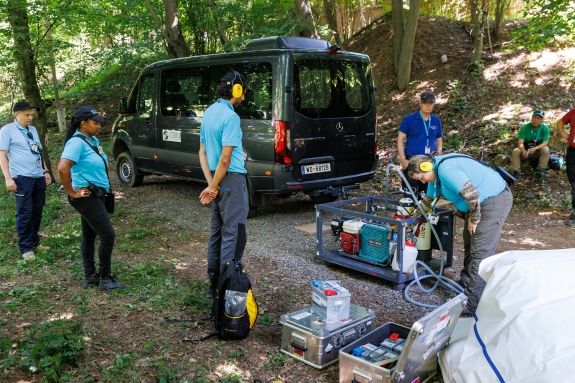 The Inspection Field Team setting up a compressor for collecting an air sample