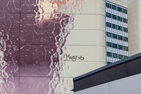 Lower section of mural with signature of artist Magee