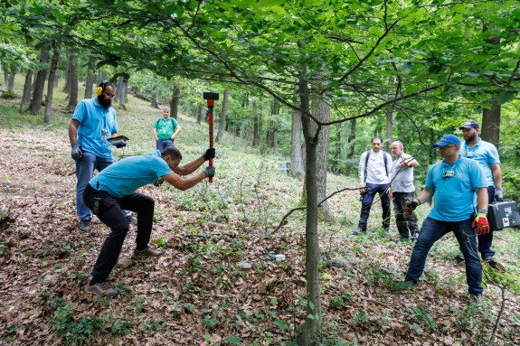 Surrogate inspectors perform an active seismic survey on a hill in one of the search zones