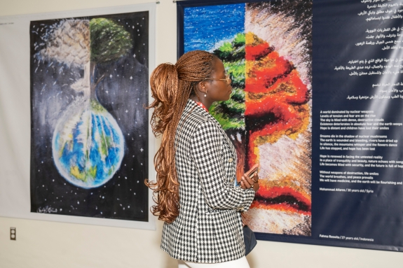 Delegate looking at CYG art