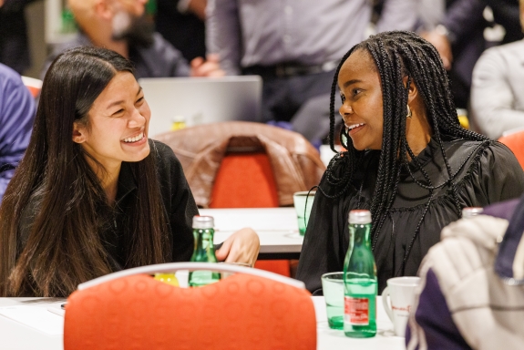 Participants speaking to each other during day three of Technical Meeting
