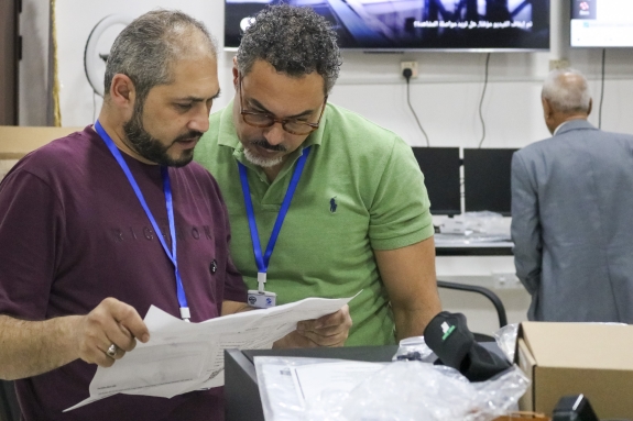 CTBTO staff consulting technical manuals during CBS setup
