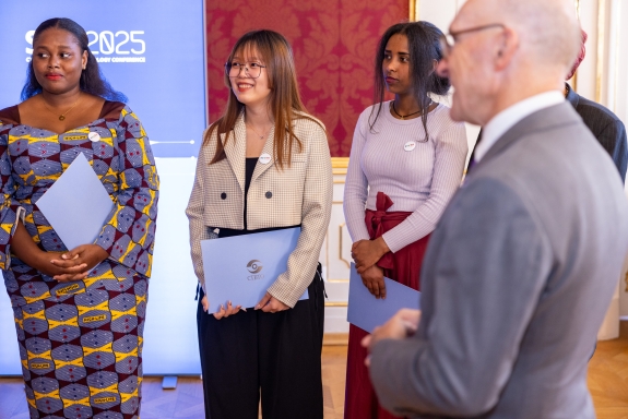 CTBTO Mentoring Programme participants at SnT2025 meeting with Floyd 