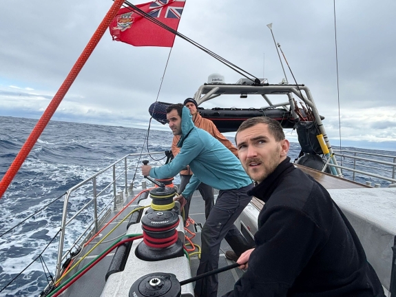 (Left to Right) WATC Engineer Riley Bickford and CTBTO Seismoacoustic Engineer Gregory Brenn working winches in Beagle Channel, with Skipper Tor Bohim providing direction