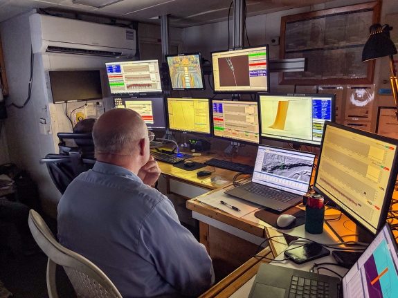 Precision cable-laying operation at control station on bridge 
