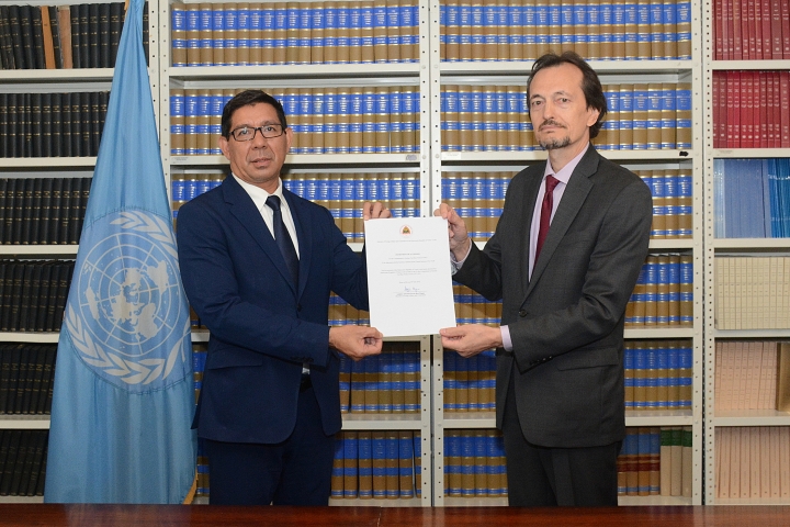 Ratification ceremony attended by Karlito Nunes, Permanent Representative of Timor-Leste to the UN, and Andrei Kolomoets, Acting Chief, Treaty Section of the UN Office of Legal Affairs