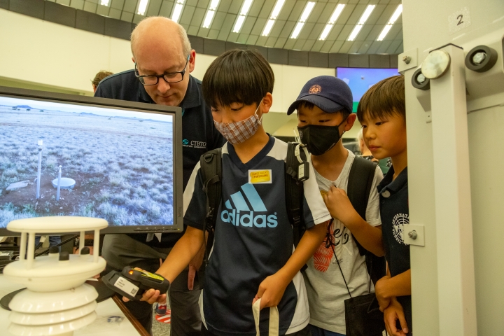Children learn about radiation detection equipment, which would be used in an on-site inspection (OSI) of a potential nuclear site
