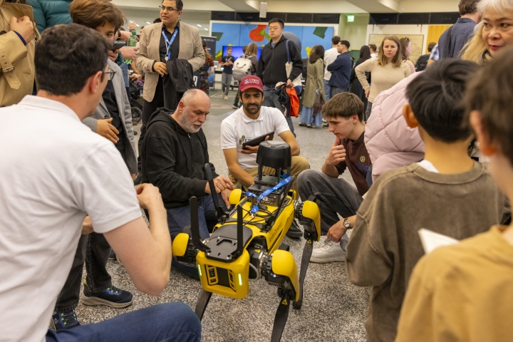 Visitors interacting with CTBTO’s robot dog
